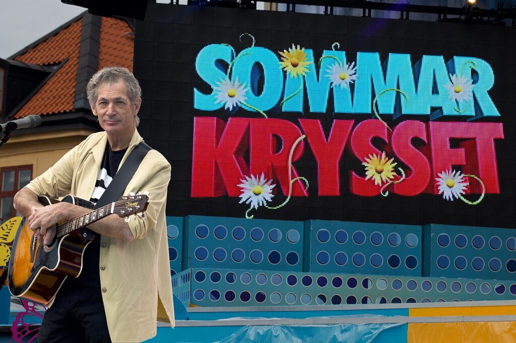 Doug Seegers performing with guitar on the Sommarkrysset stage in Sweden