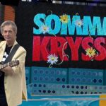 Doug Seegers performing with guitar on the Sommarkrysset stage in Sweden